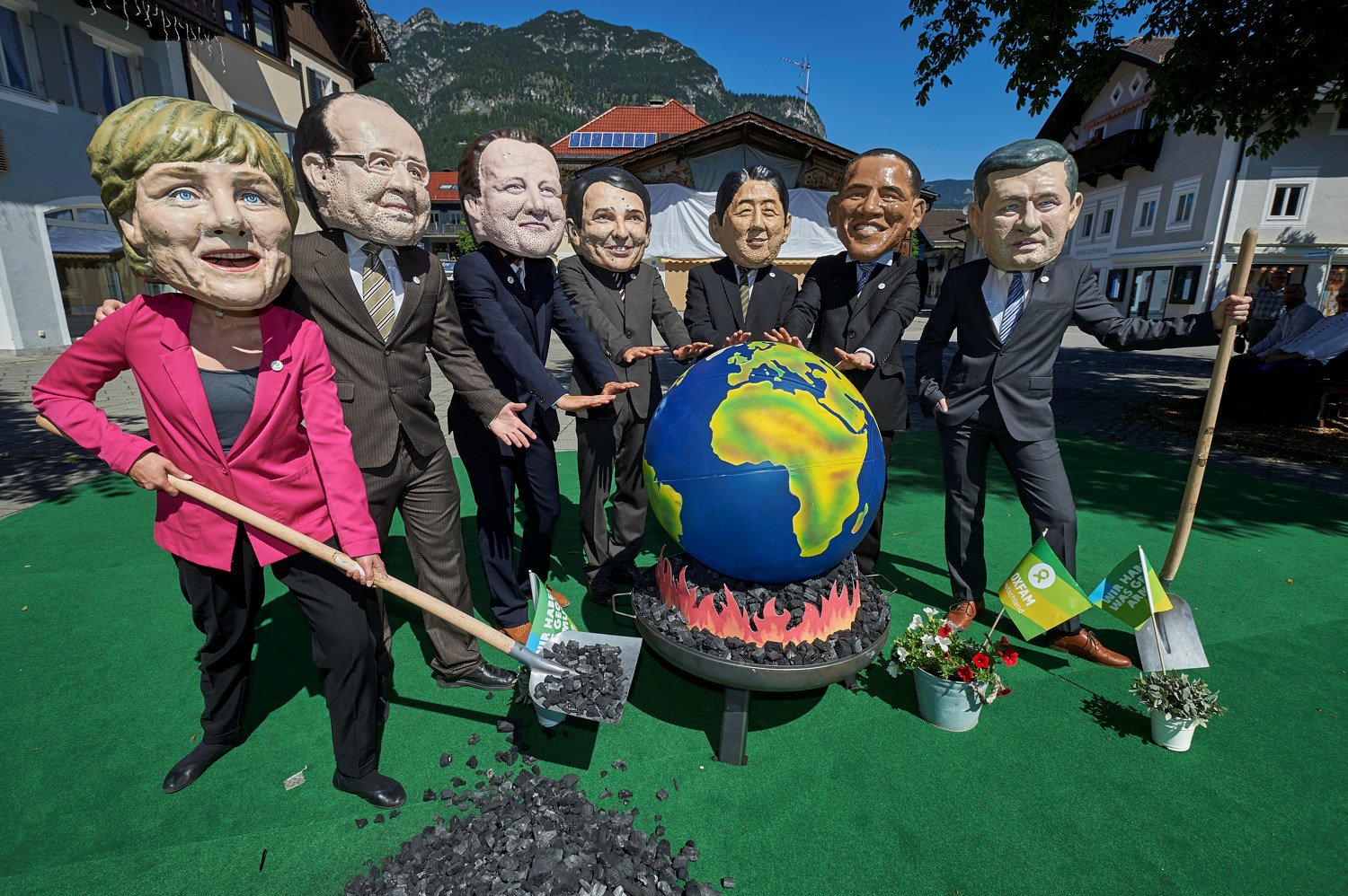 Oxfam is calling for G7 leaders, pictured barbecuing the planet at the G7 Summit, to kick their dirty coal habit.