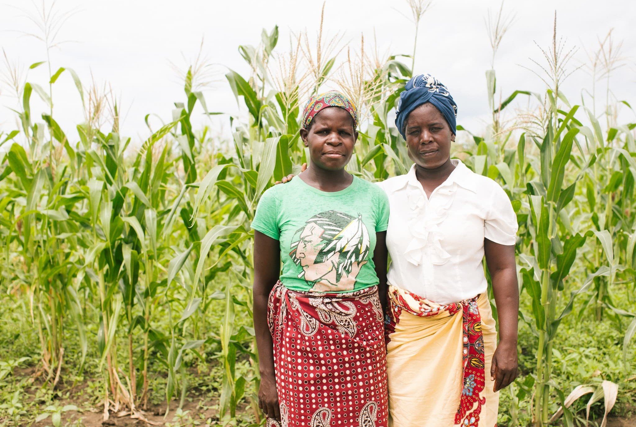 Virginia (left), a farmer and a mother from Josina Machel village in Mozambique, lost everything in the cyclone. She came to Ndedja resettlement site to receive tools and seeds from Oxfam’s partner Kulima. However, the crops she planted in the aftermath of the cyclone were damaged by severe floods again in January this year. (Photo: Elena Heatherwick / Oxfam)